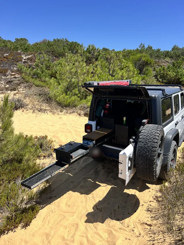 Prototype kitchen extended from a car in the dunes